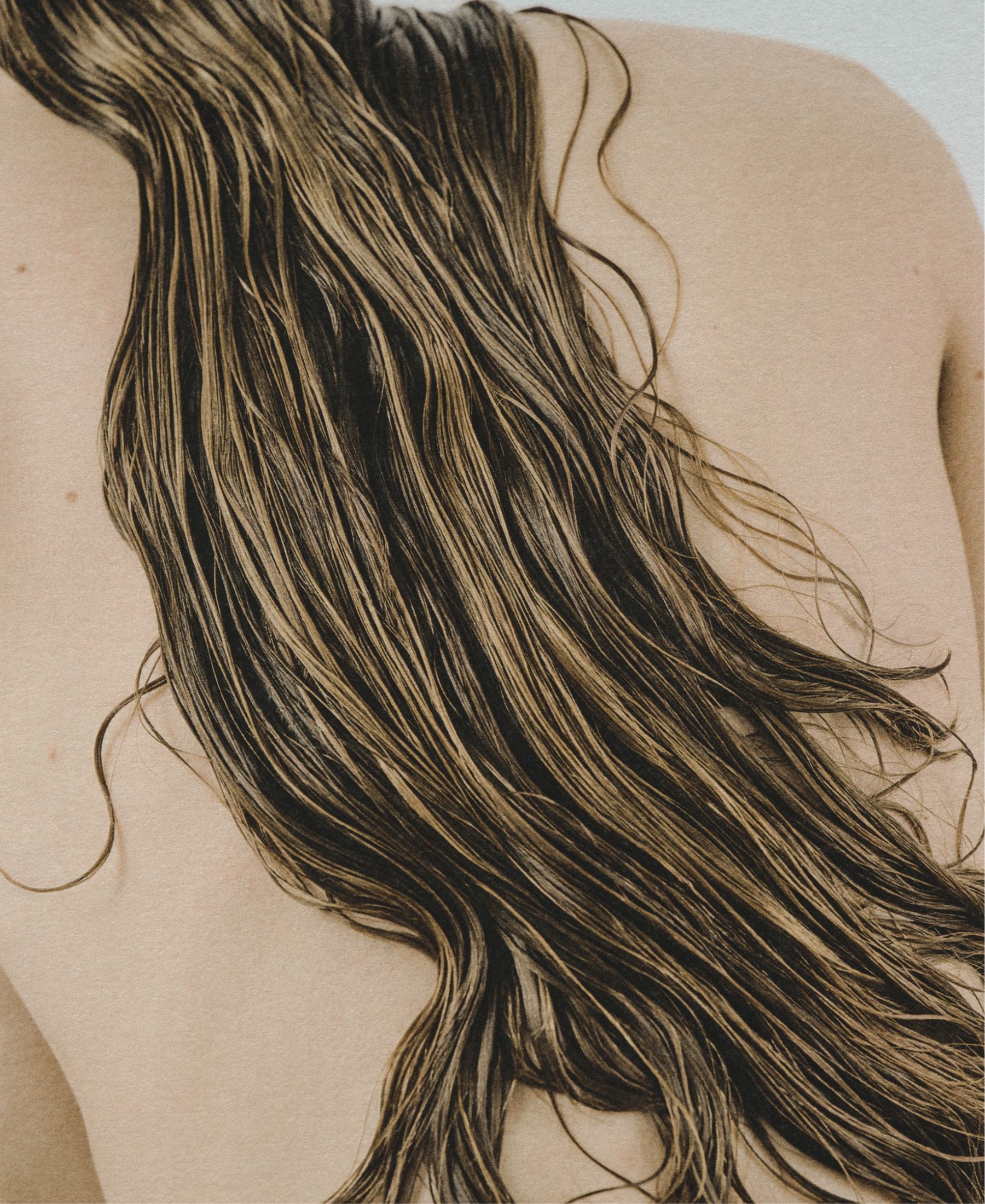 Wet strands of Sasha Konograeva’s hair falling across her bare back in a close study of line and texture.